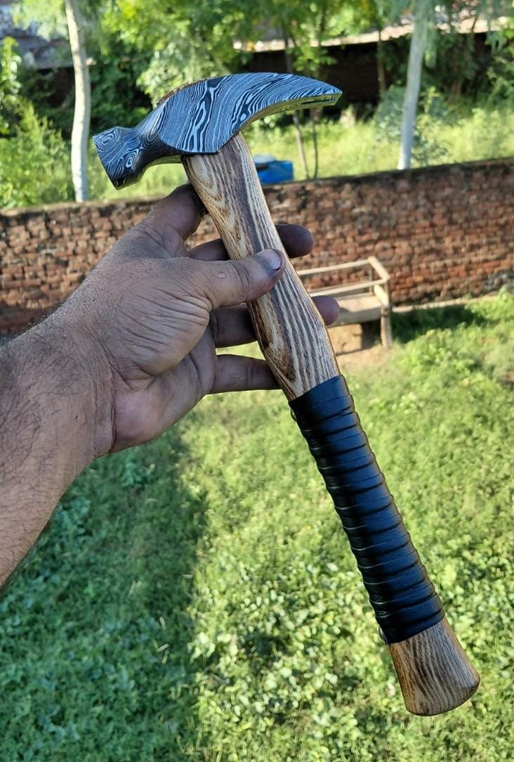 Handmade Damascus steel hammer with patterned steel head and wood handle